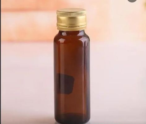 500 ml szklana butelka doustna z płynem brązowa bursztynowa okrągła